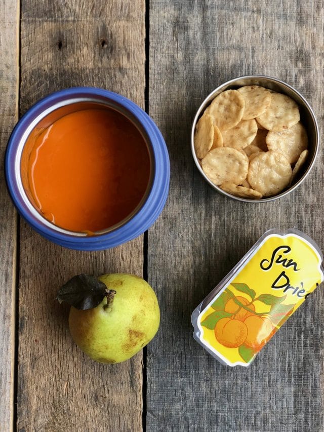 10 Simple School Lunches from Trader Joe's - tomato soup, gluten free crackers, dried apricots and a mini pear.