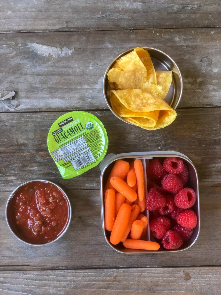 Cheese quesadilla with guacamole, salsa, baby carrots and raspberries