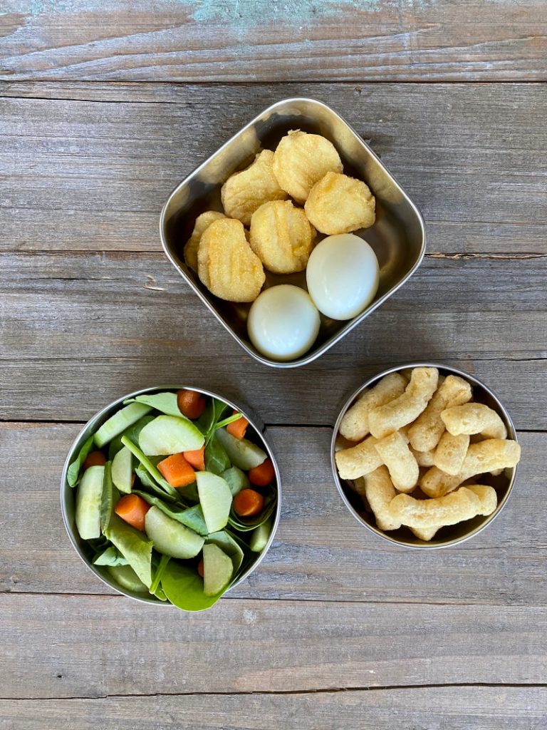 Chicken nuggets, hard boiled eggs, mixed green salad, Hippeas - another Costco lunch