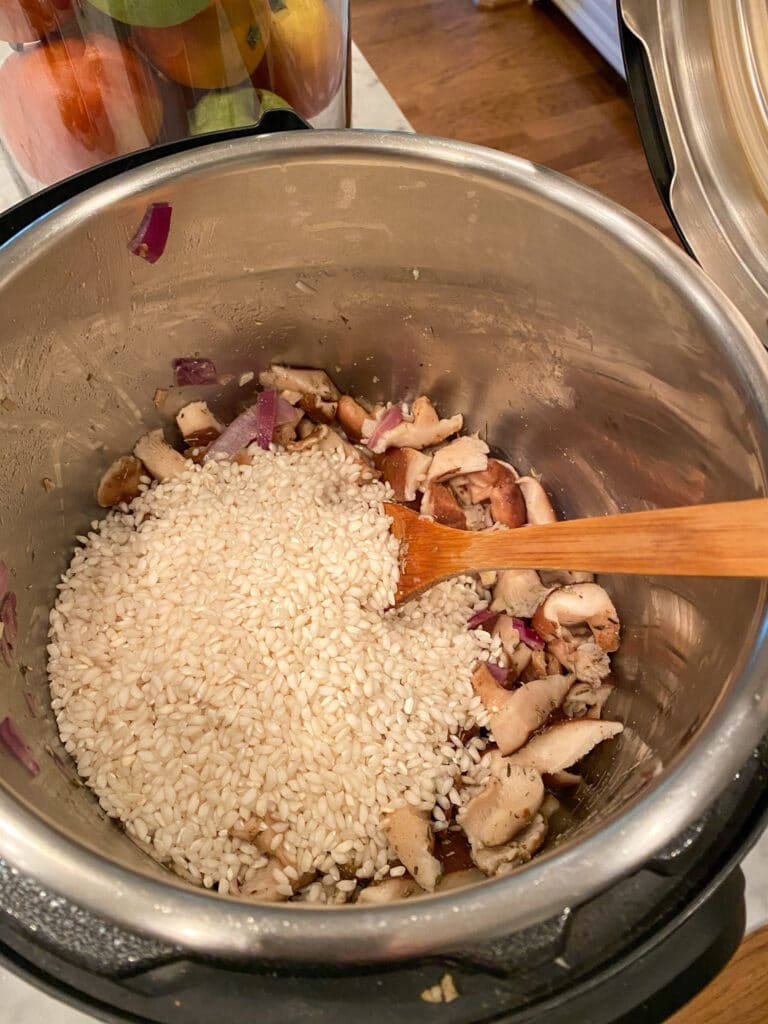 Add mushrooms and risotto to Instant Pot