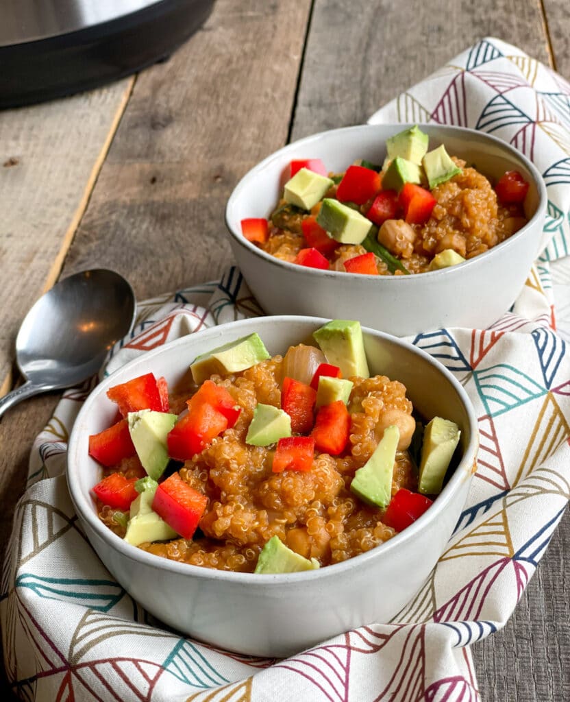 Top this quinoa chickpea stew with diced fresh vegetables, avocado and more