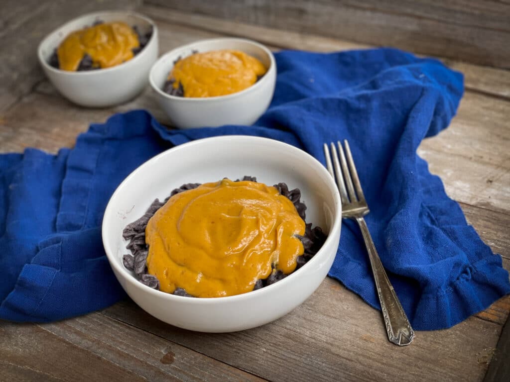 easy "cheeze" sauce made with sweet potatoes and carrots on top of pasta