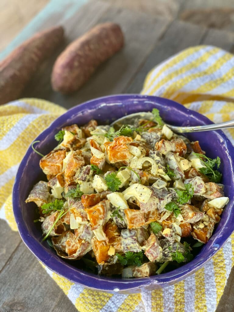 purple bowl with healthy paleo sweet potato salad