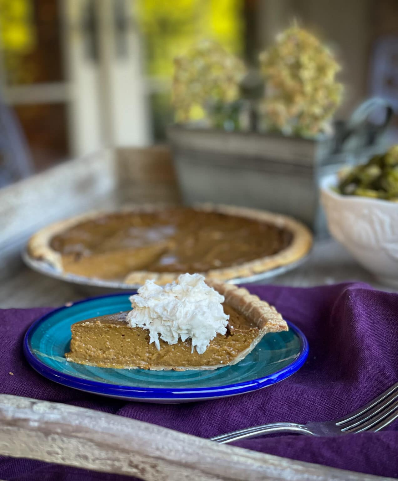 slice of dairy free pumpkin pie on a plate